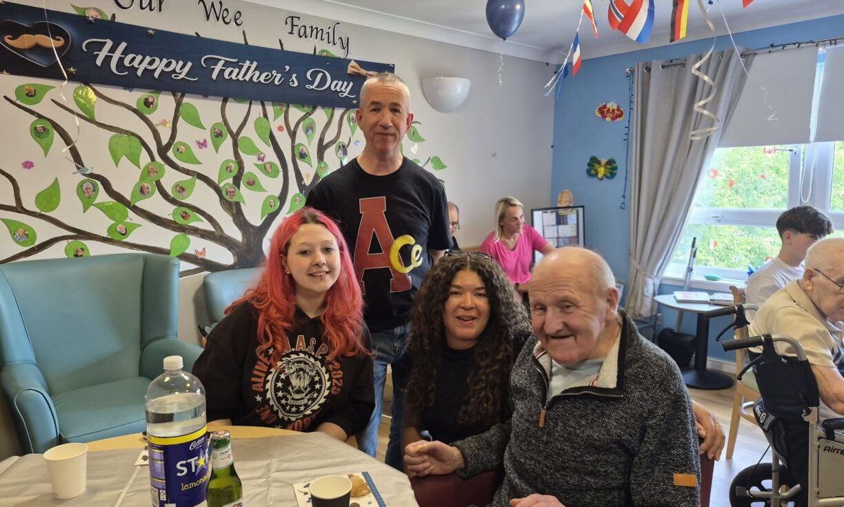 Residents and staff enjoying a relaxed Father's Day afternoon at Carnbroe Care Centre